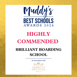 An image featuring a certificate with the heading "Muddy's Best Schools Awards 2024." It indicates that TDM Brilliant Boarding School is "Highly Commended" in the category "Brilliant Boarding School." The certificate mentions that it is in association with Debrett's Education.